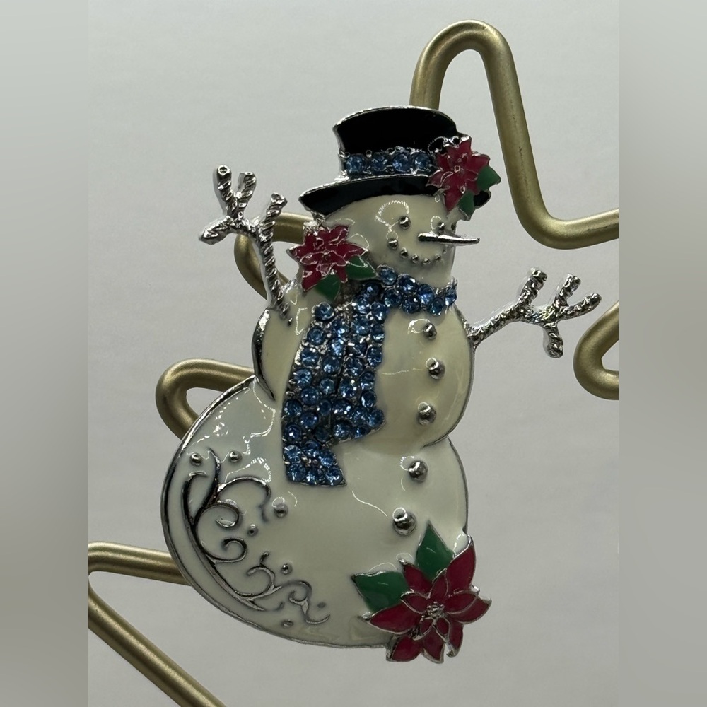 Enameled Snowman brooch with blue rhinestones and poinsettia